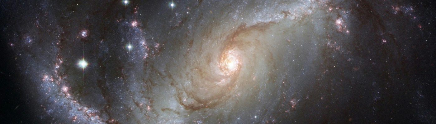 Capture of the NGC 1672 spiral galaxy showcasing its majestic spiral arms and bright core.